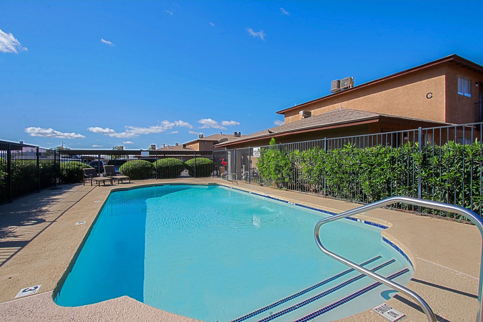 Pool and poolside area at Aire Libre Apartment Homes.